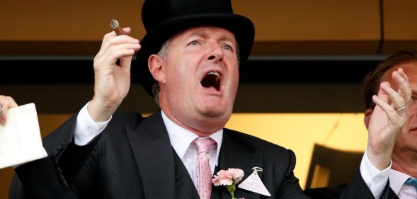 Piers Morgan smokes a cigar whilst watching the racing on day two of Royal Ascot at Ascot Racecourse on June 19, 2019 in Ascot, England