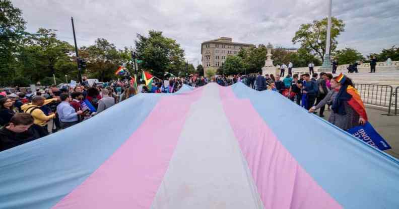 A giant trans flag unfurled outside the US Supreme Cour