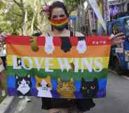 A foreign resident in Taiwan displays a rainbow flag at Taipei 2020 LGBT+ Pride
