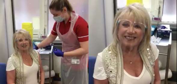Elaine Paige, with a screen visor, receives her second coronavirus vaccine dose