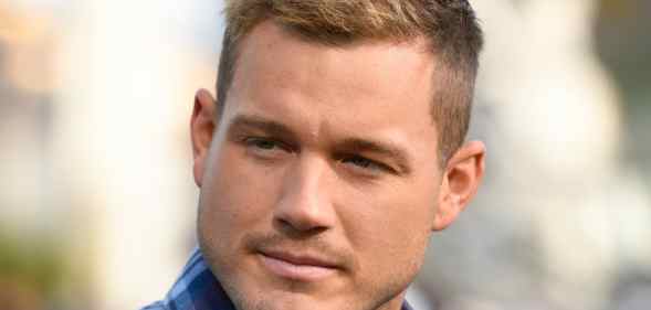 Colton Underwood pensively stares to his right