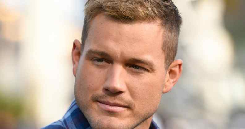 Colton Underwood pensively stares to his right