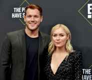 Colton Underwood (L) and Cassie Randolph pose together on the red carpet