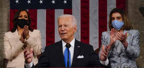 President Joe Biden addresses a joint session of Congress, with vice president Kamala Harris (L) and House speaker Nancy Pelosi (R) on the dais