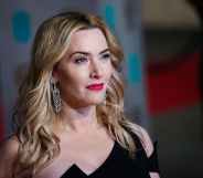 Actor Kate Winslet is dressed in a black evening dress as she attends a press event