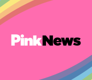 PinkNews logo on pink background with rainbow corners.