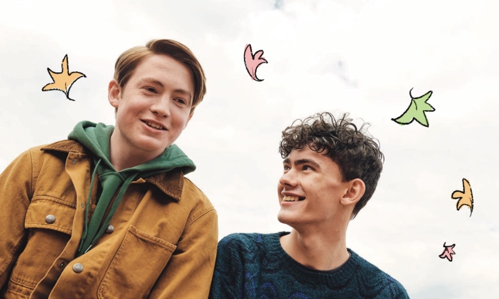 A screenshot from Netflix's Heartstopper featuring actors Kit Connor and Joe Locke who play Nick Nelson and Charlie Spring