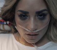 Demi Lovato sings from a hospital bed in her new "Dancing With The Devil" music video