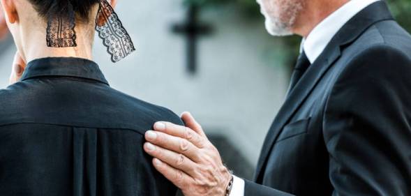 funeral image two people in mourning
