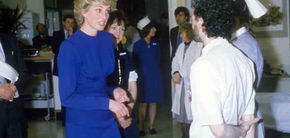 Princess Diana on a hospital ward talking to nurses
