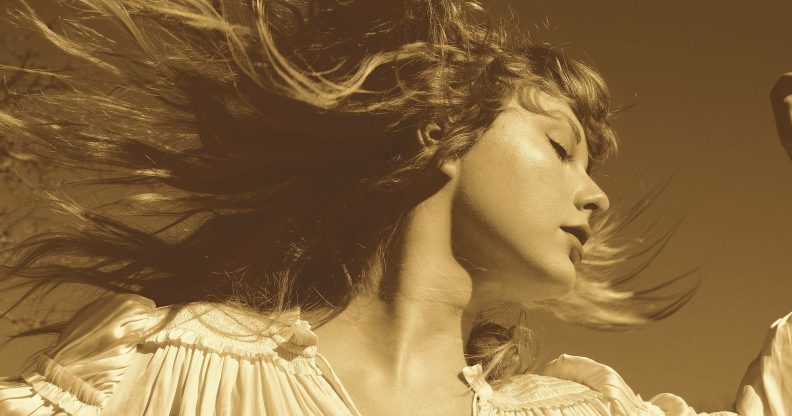 Taylor Swift on the Fearless (Taylor's Version) cover, looking to the right with her hair swept up in the wind