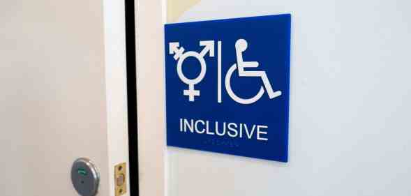 Sign for inclusive restroom, with symbol indicating male, female and transgender as well as handicapped symbol, part of LGBT rights initiatives in the Mission District neighborhood of San Francisco