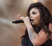 Jesy Nelson sings into the microphone