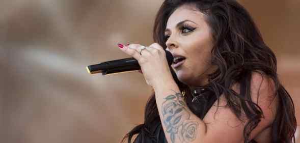 Jesy Nelson sings into the microphone