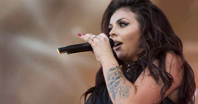 Jesy Nelson sings into the microphone