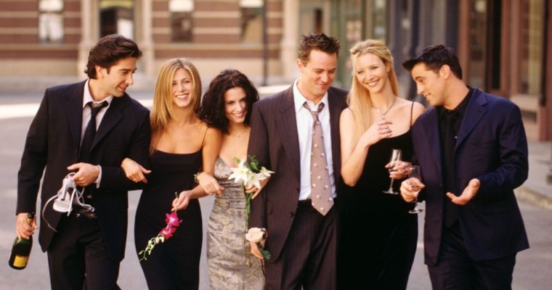 The cast of Friends walking down a street