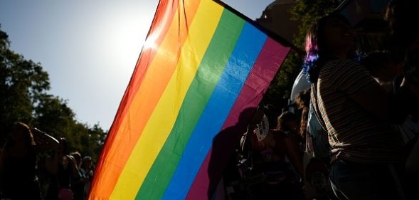 Participants wave a rainbow flag during the 2019 Gay Pride parade in Barcelona