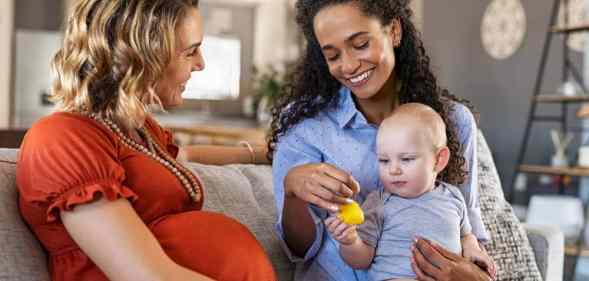 happy same-sex couple celebrating children