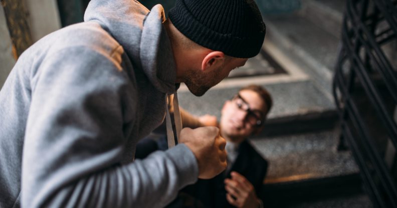 Street theif commits a robbery attack on a man in the entrance