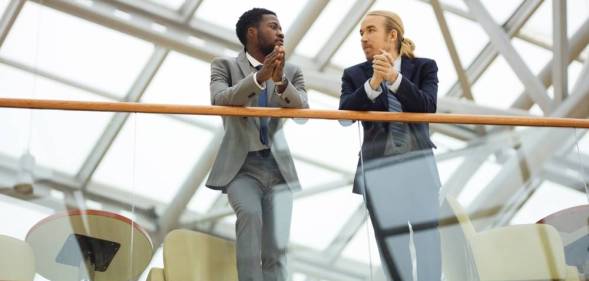 two men at work talking