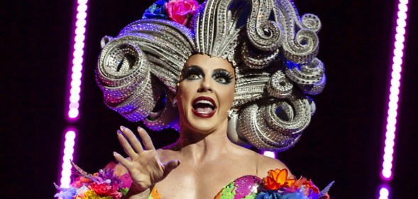 Alyssa Edwards in a huge, sculpted silver wig and rainbow-coloured dress