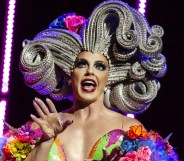 Alyssa Edwards in a huge, sculpted silver wig and rainbow-coloured dress