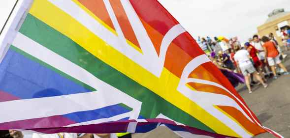 A rainbow Union Jack during Brighton Pride Parade