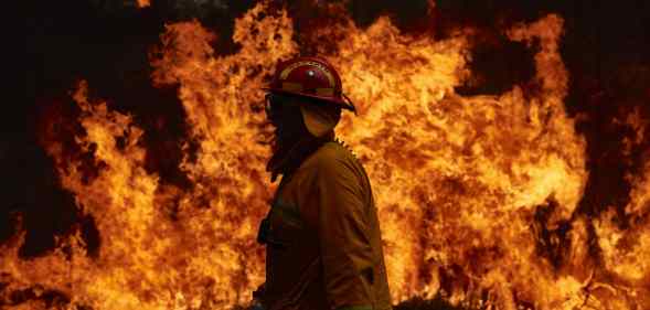 A CFA Member works on controlled back burns