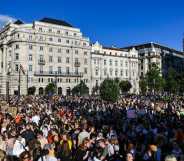 thousands protest outside Hungary's parliament against a bill which has now passed, banning the mention of LGBT+ people in schools