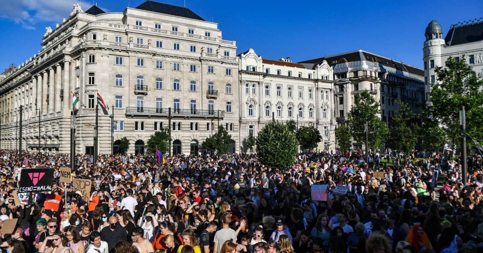 thousands protest outside Hungary's parliament against a bill which has now passed, banning the mention of LGBT+ people in schools