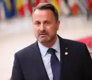 Prime minister of Luxembourg Xavier Bettel speaks to press members as he arrives for the first day of European Union (EU) Summit