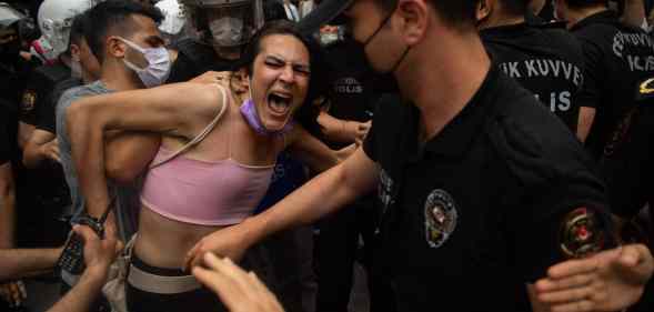 A protester is detained by police the Pride march in Istanbul on 26 June, 2021