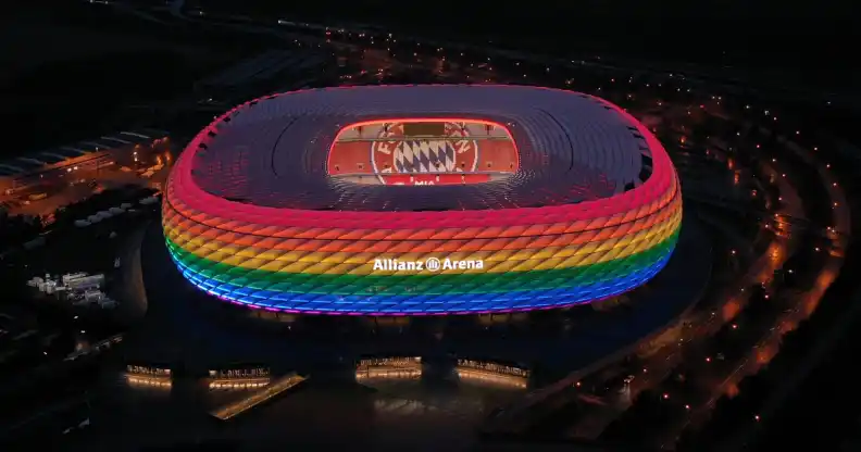 The Allianz Arena football stadium illuminated in rainbow colours