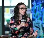 Jessica Stern wears a floral shirt as she speaks into a microphone
