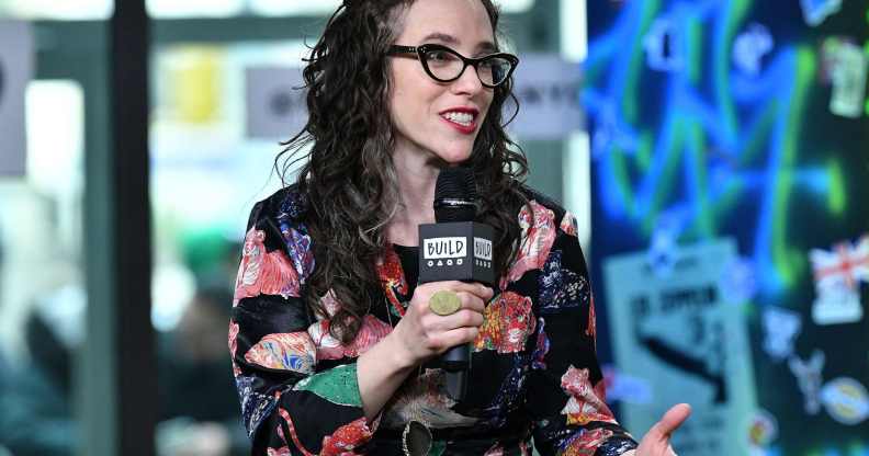 Jessica Stern wears a floral shirt as she speaks into a microphone