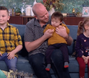 Ben Carpenter with three of his six adopted children