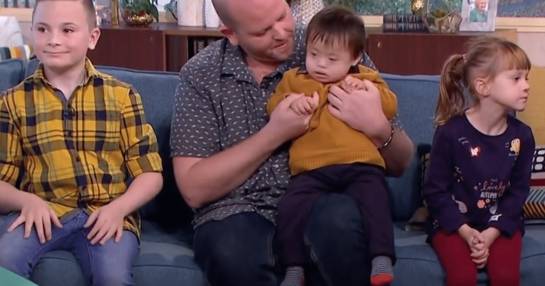 Ben Carpenter with three of his six adopted children