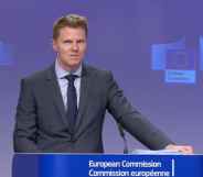 Christian Wigand speaks at a European Commission press briefing in a grey suit