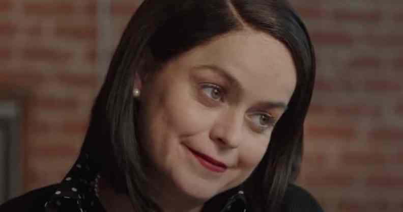 Tanya Manning in Karen, smiling as she cocks her head to the side