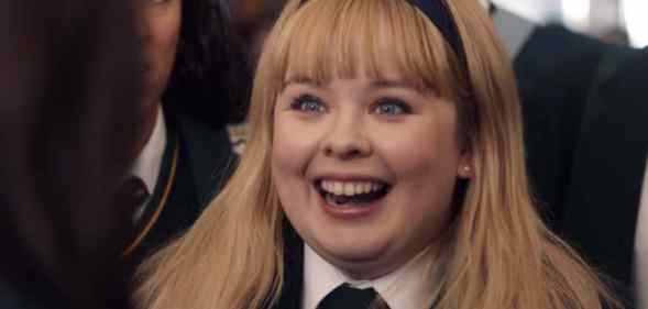 Nicola Coughlan as Derry Girls' Clare, in school uniform and headband