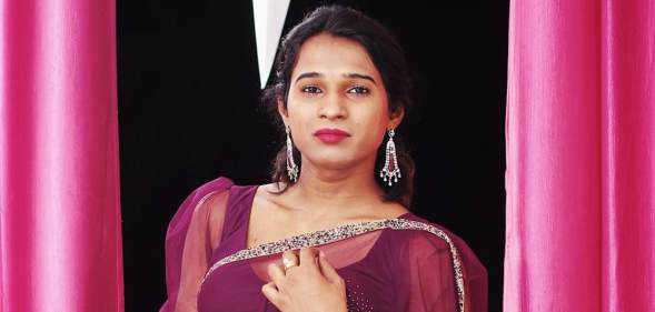 Anannyah Kumari Alex against pink curtains and in a purple dress