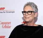 Jamie Lee Curtis wearing black top on the red carpet