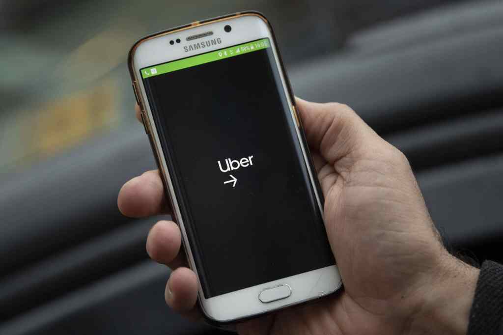 A phone displaying the Uber logo