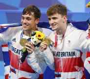 Tom Daley Matthew Lee pose with their gold medals at the Tokyo 2020 Olympic games