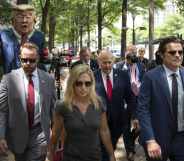 Protestors hold an effigy of former President Donald Trump as Marjorie Taylor Greene, Louie Gohmert and Matt Gaetz arrive for a news conference
