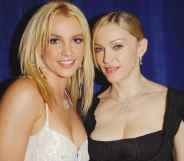 Britney Spears(L) and Madonna pose backstage during the 2003 MTV Video Music Awards