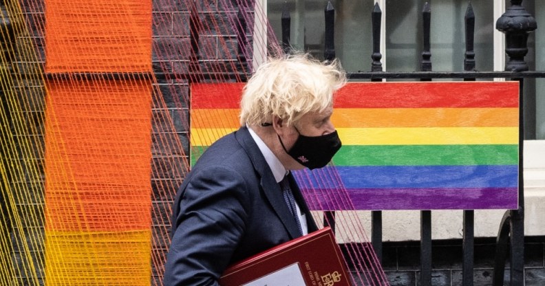Boris Johnson walks beneath the Pride Month installation outside number 10
