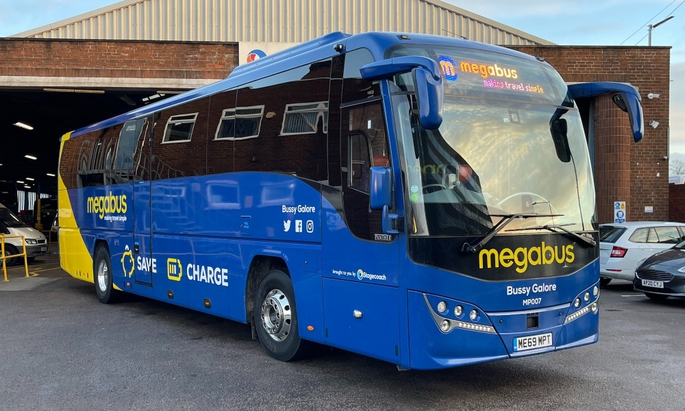 A blue bus with the words 'Bussy Galore' on the front