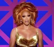 RuPaul dressed in a gold dress appears as judge on Drag Race