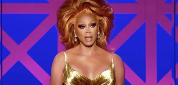 RuPaul dressed in a gold dress appears as judge on Drag Race